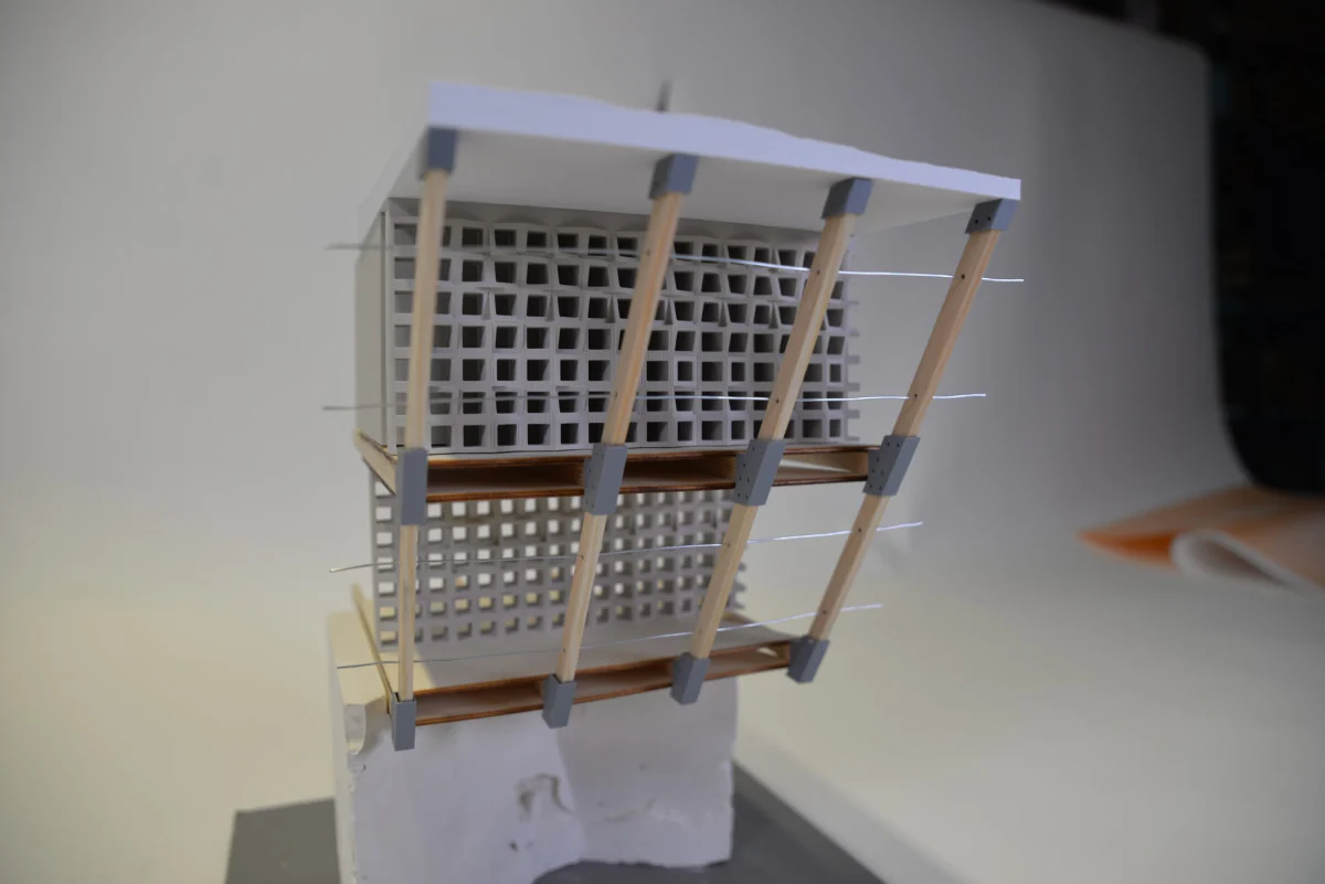 Model study with timber struts and perforated panels